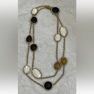 Gold tone necklace with wood and mother of Pearl shapes 52” long V by Eva